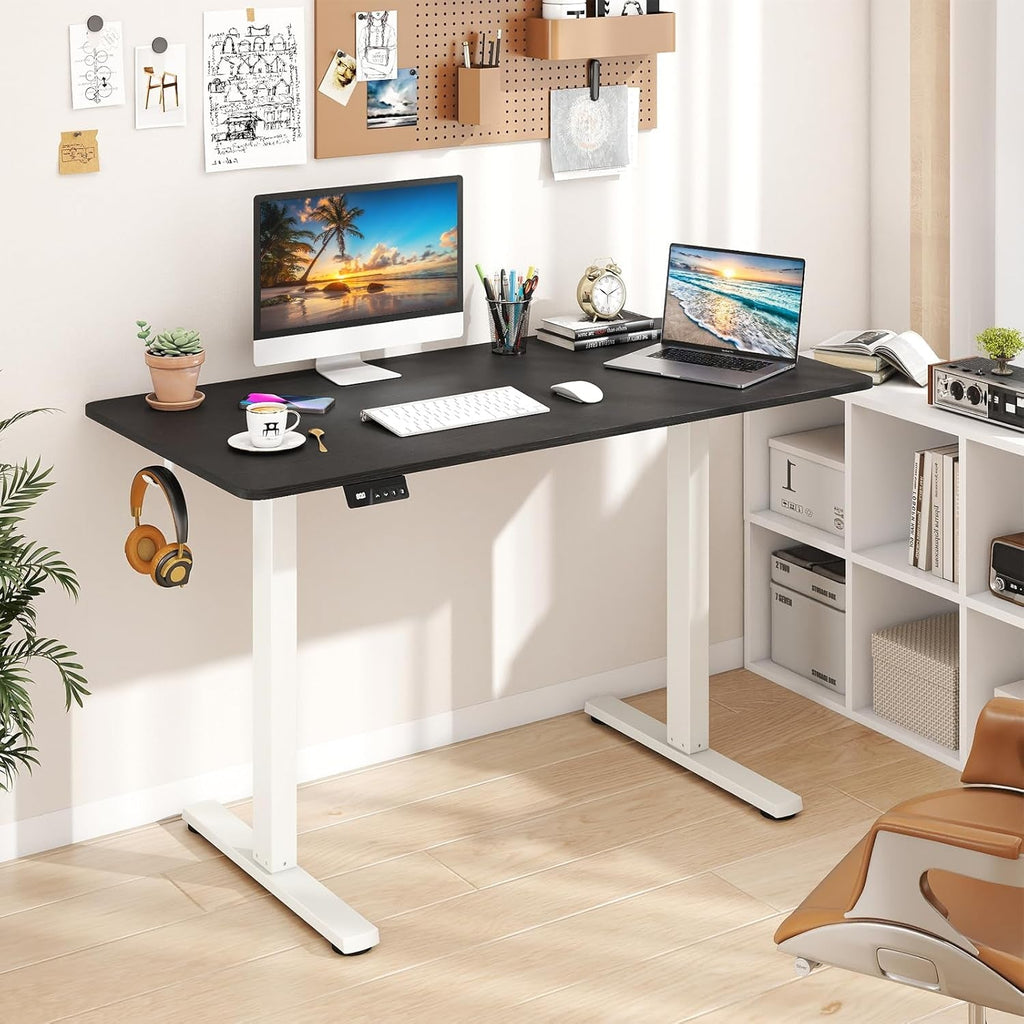 Electric standing desk raised to standing height