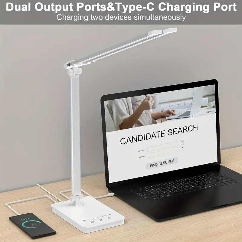 White double arm banker lamp folded over a desk