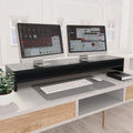 Black monitor riser one metre long with a shelf underneath