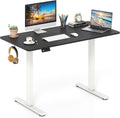 Electric standing desk raised to standing height