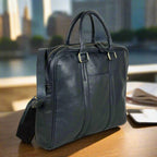 Black full grain leather messenger bag with a flap closure
