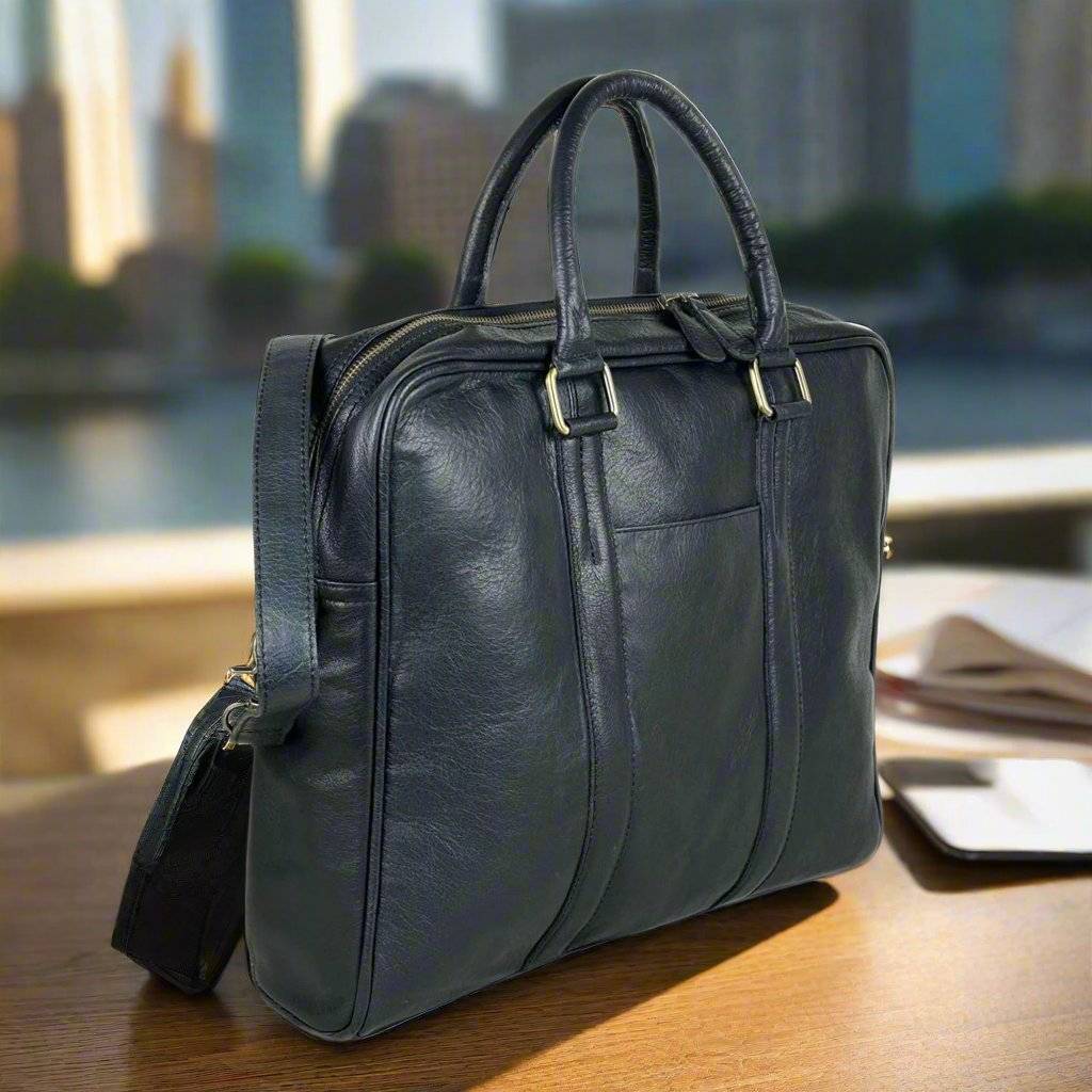 Black full grain leather messenger bag with a flap closure