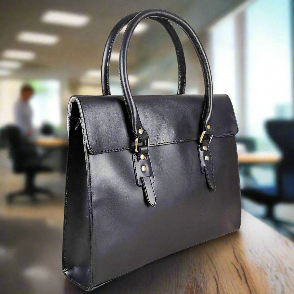 Black leather laptop bag with a full flap closure