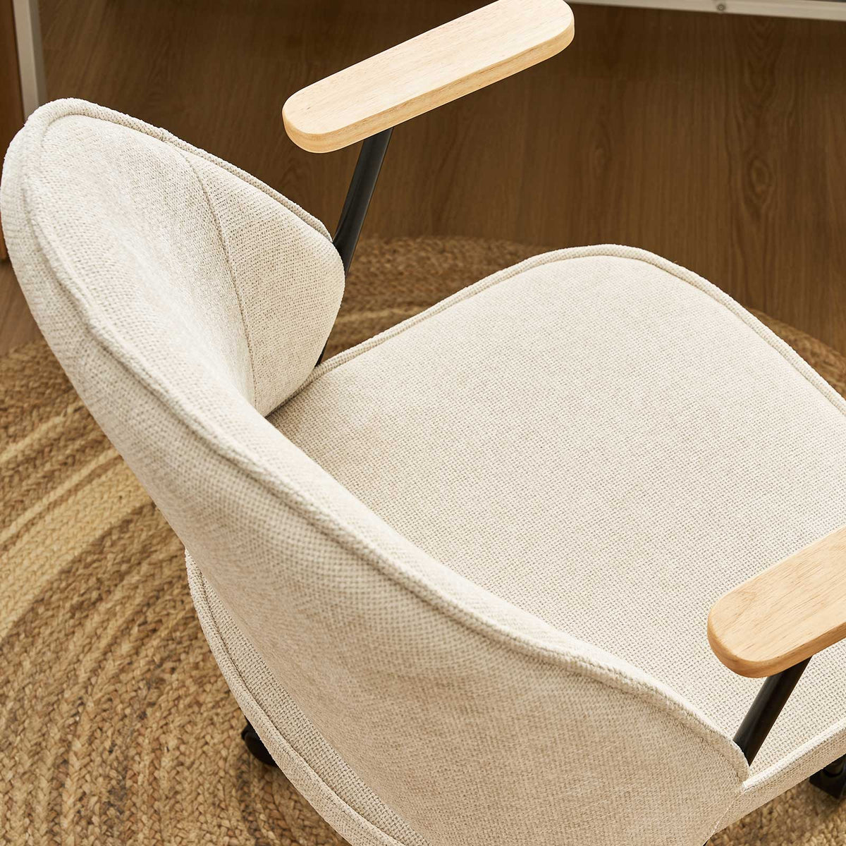 Upholstered rolling office chair on castors