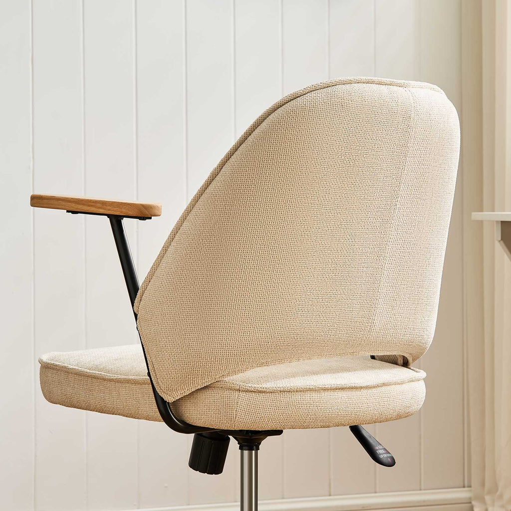 Upholstered rolling office chair on castors