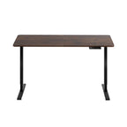 Height adjustable standing desk with a rustic brown top and black frame