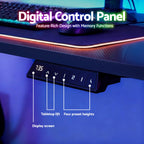 Black electric standing desk at standing height