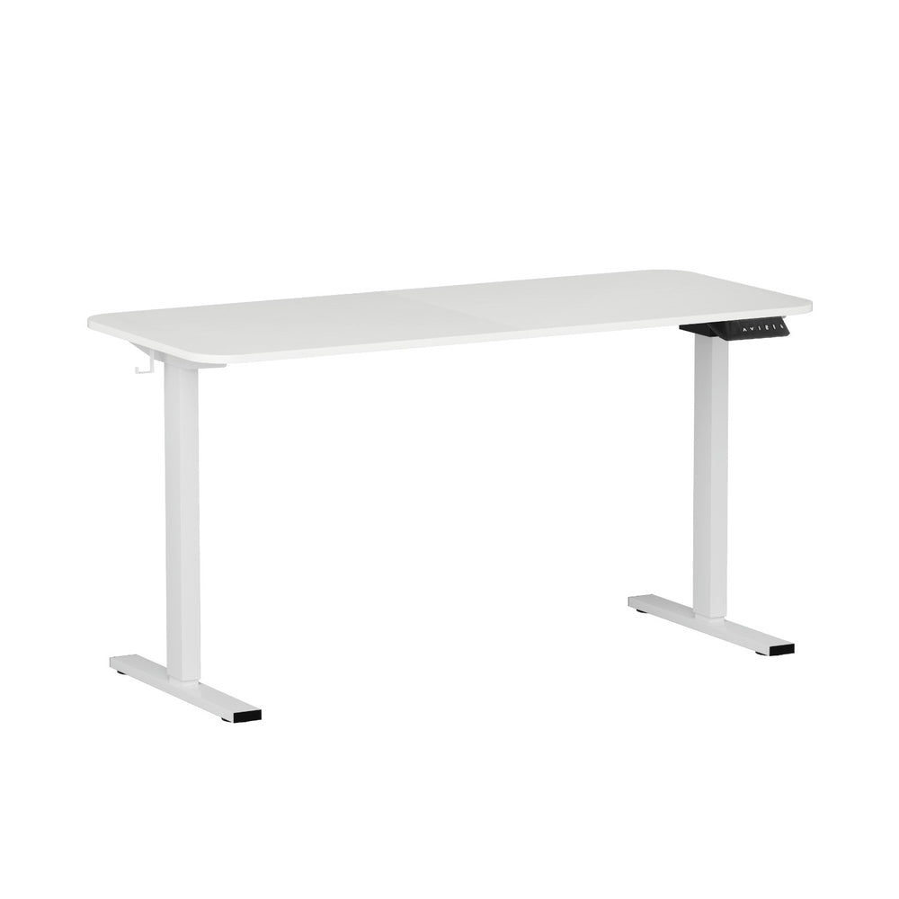 White electric standing desk raised to standing height