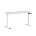 White electric standing desk raised to standing height