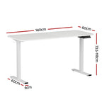 White electric standing desk raised to standing height