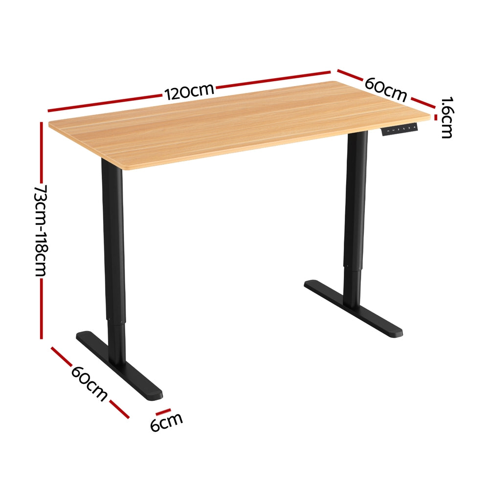 Electric sit stand desk with a natural wood top raised to standing height