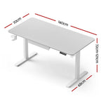 White electric standing desk with a built in stationery drawer