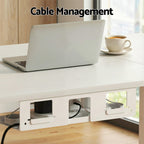 White electric standing desk with a built in stationery drawer