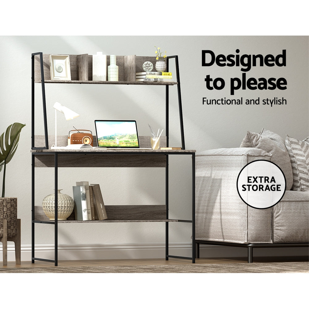 Grey steel workstation desk with a partitioned shelf above the work surface