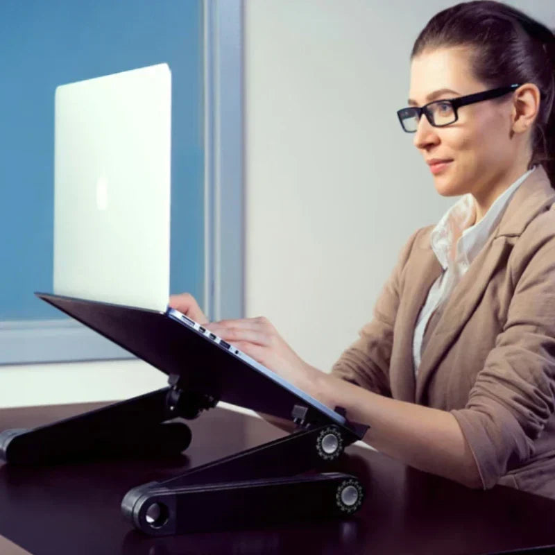 Foldable laptop stand with a vented deck