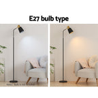 Slim black floor lamp with a metal frame and weighted base