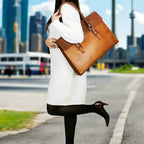 Tan leather laptop bag with a full flap closure