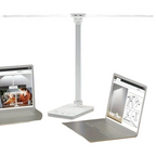 White double arm banker lamp folded over a desk