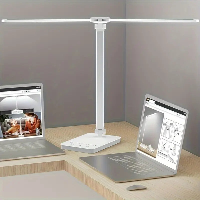 White double arm banker lamp folded over a desk