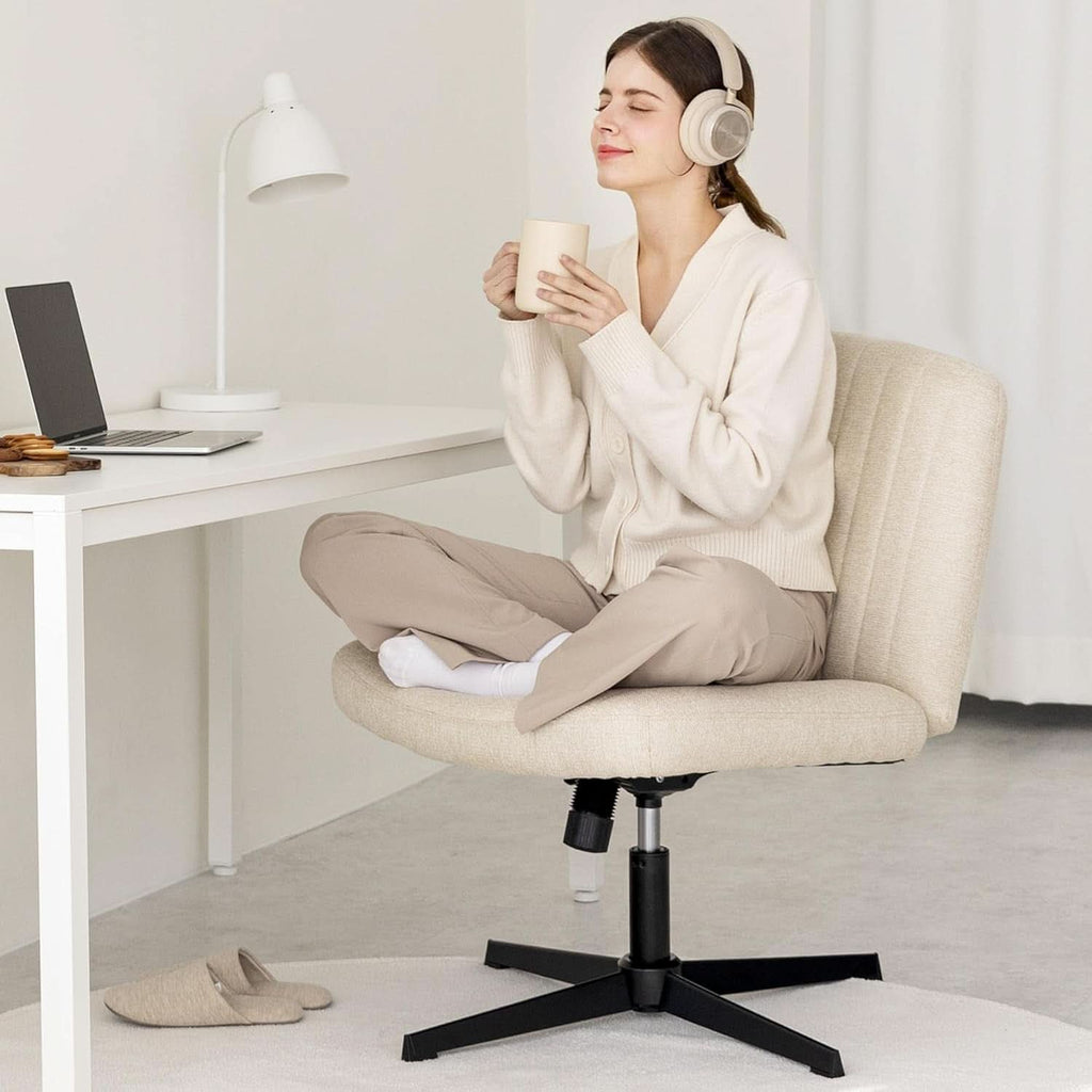 Beige fabric swivel desk chair with a wide padded seat