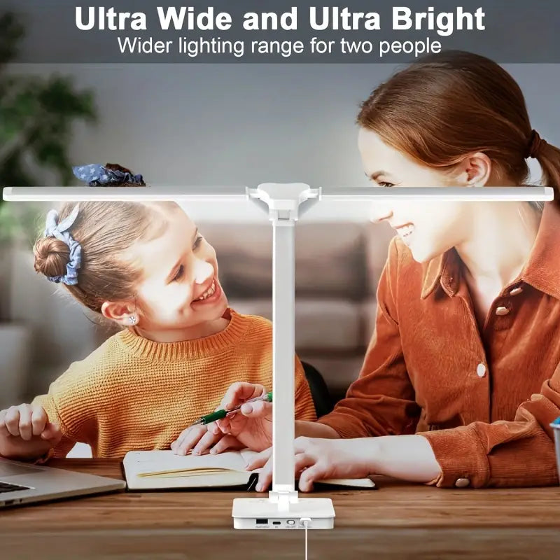 White double arm banker lamp folded over a desk
