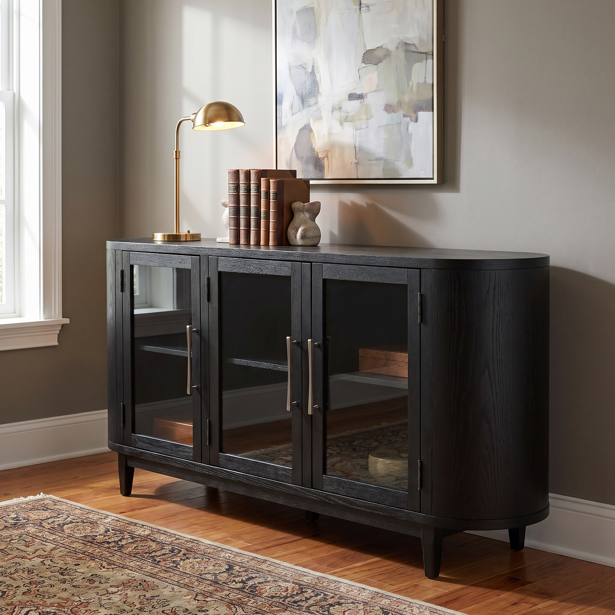 Rowanbeck Office Credenza, Black — against a wall in an office