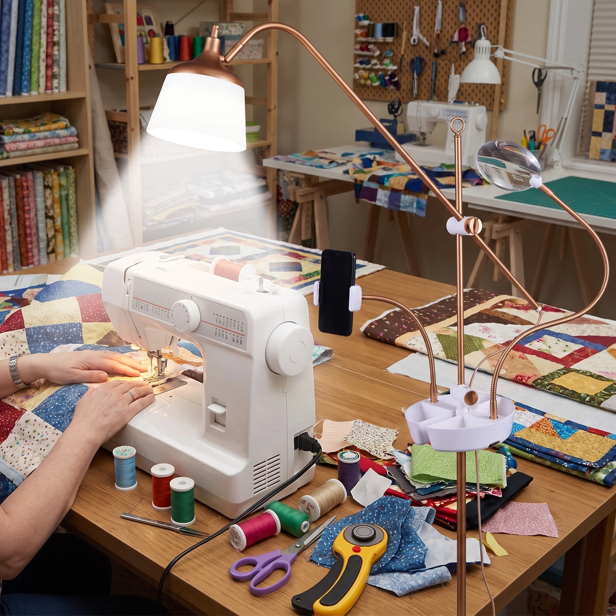 Magnifying craft lamp lighting patchwork fabric at a quilting table