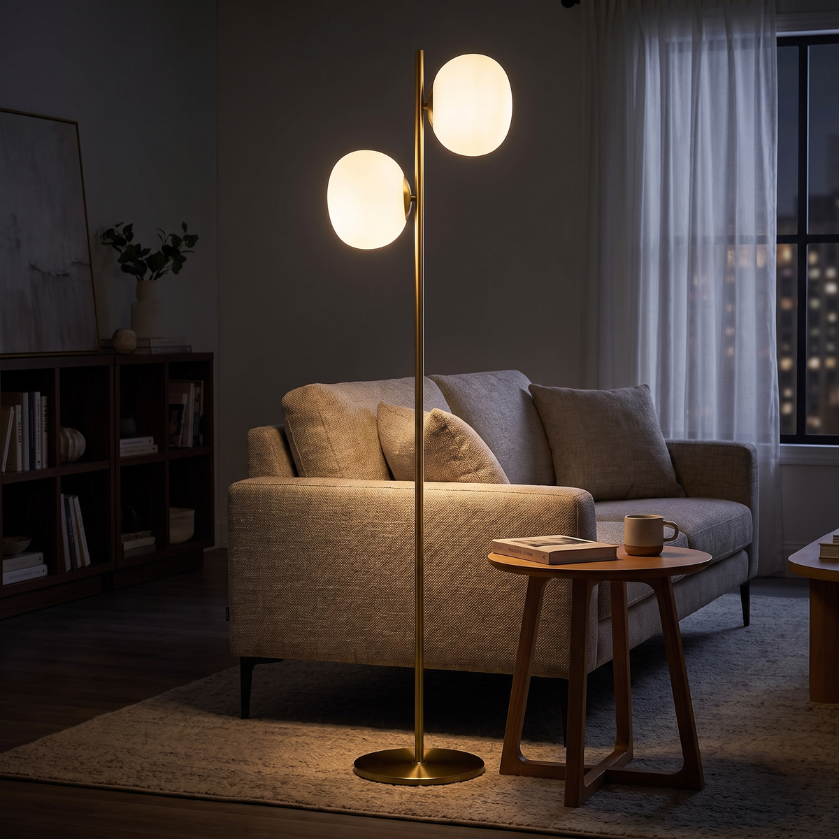 Brass and white glass two-light floor lamp beside a sofa in the evening
