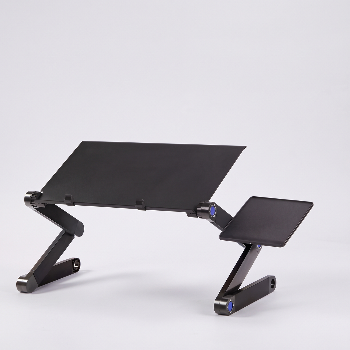 Foldable aluminium laptop stand with mouse board, studio product shot