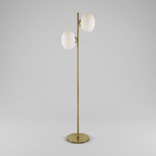 Brass and white glass two-light floor lamp, studio product shot