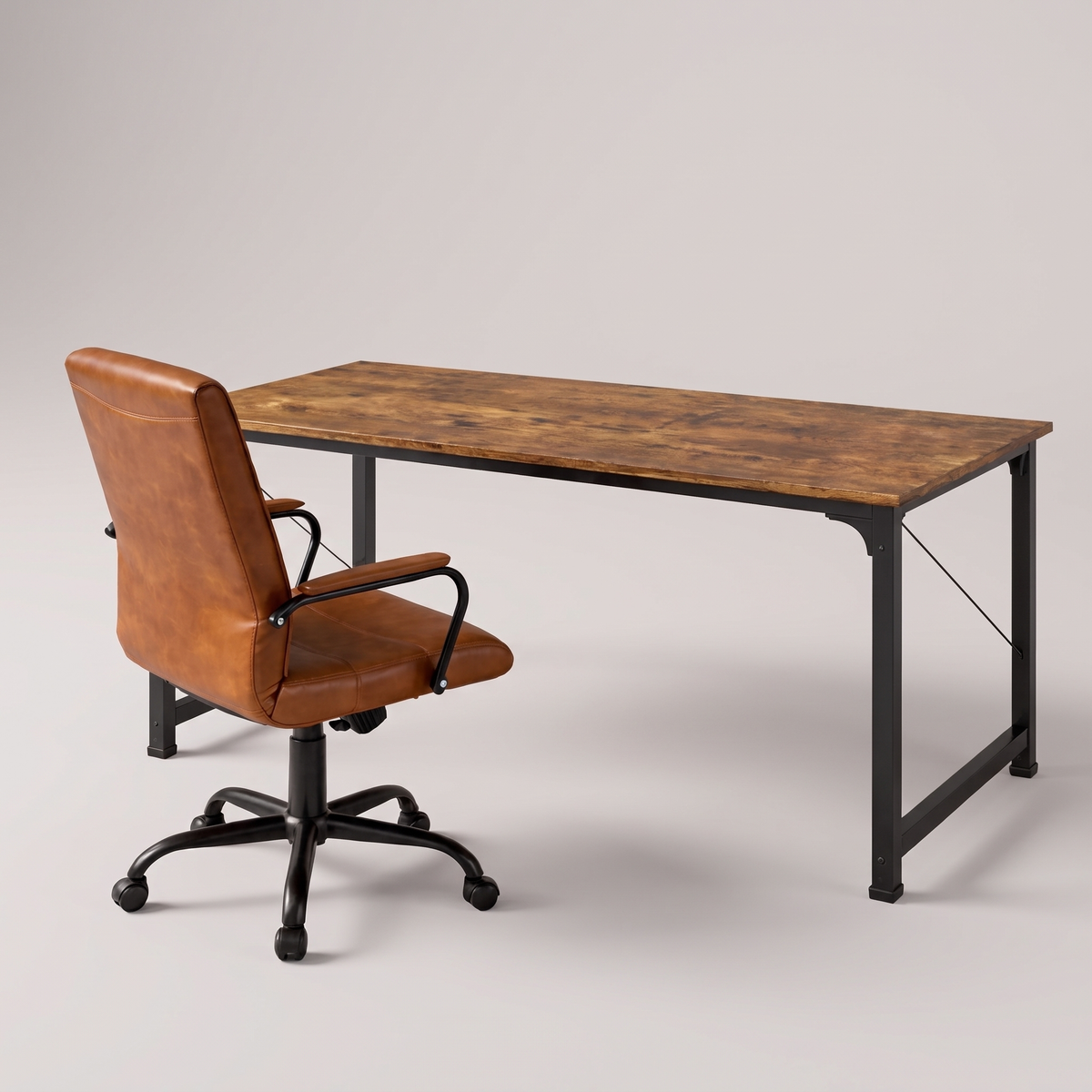 Rustic computer desk and leather chair set, studio product shot