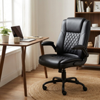 Compact black leather office chair with flip-up armrests at a small desk