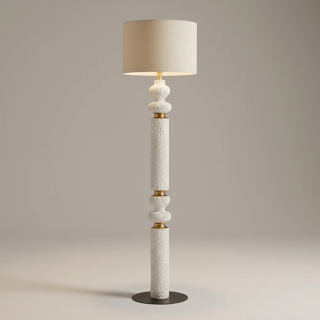 Gold-tone floor lamp with linen shade, studio product shot