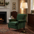 Dark wood floor lamp with linen shade beside an armchair in the evening