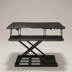 Black sit-stand desk riser, studio product shot