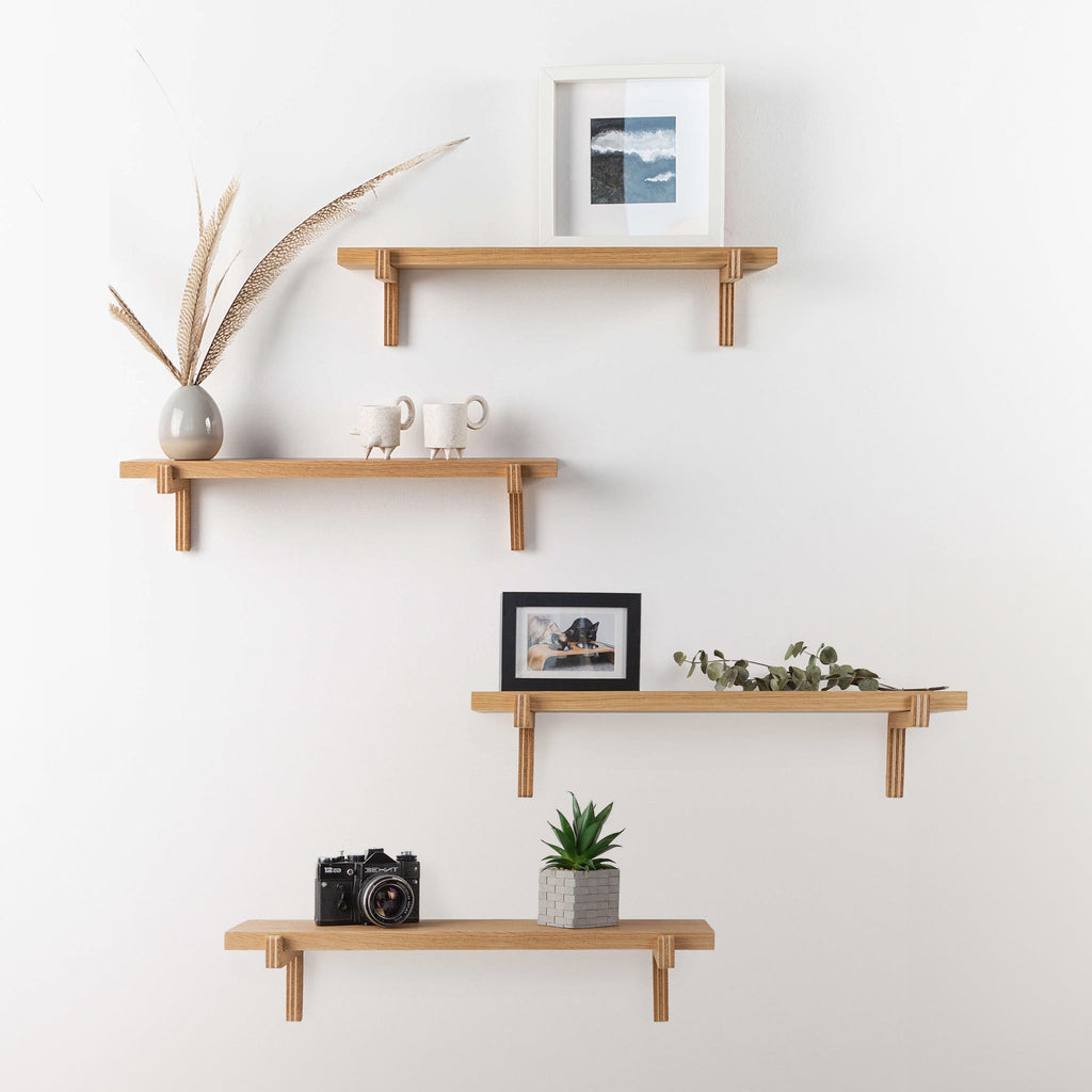 Pair of oak floating wall shelves with holders