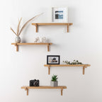 Pair of oak floating wall shelves with holders
